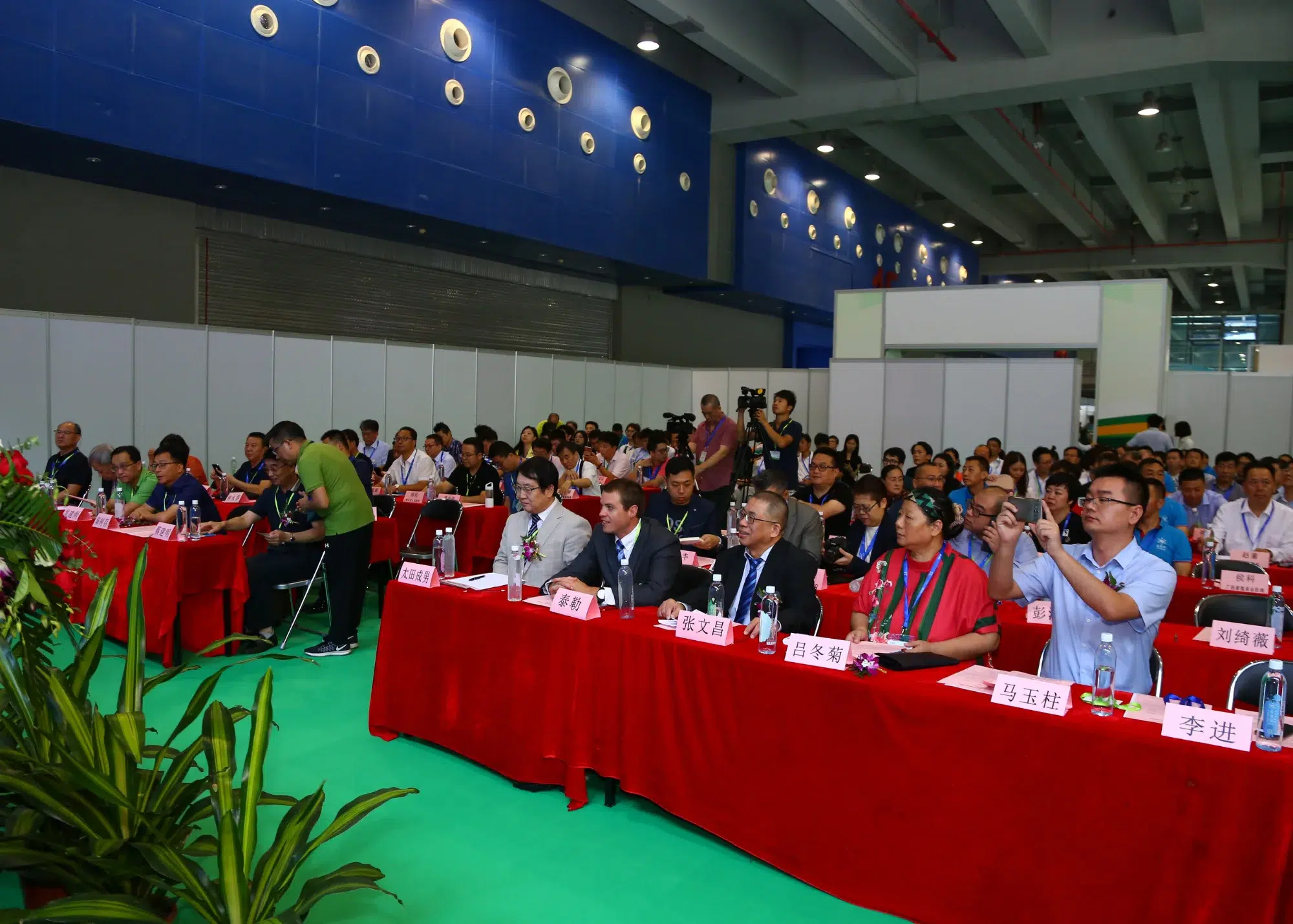 Photo of Dr. Ohta and Tyler presenting to an audience